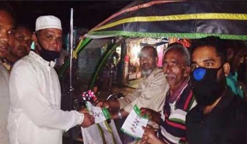 তালায় আওয়ামী লীগের করোনা উপসর্গ করনীয় লিফলেট বিতারণ